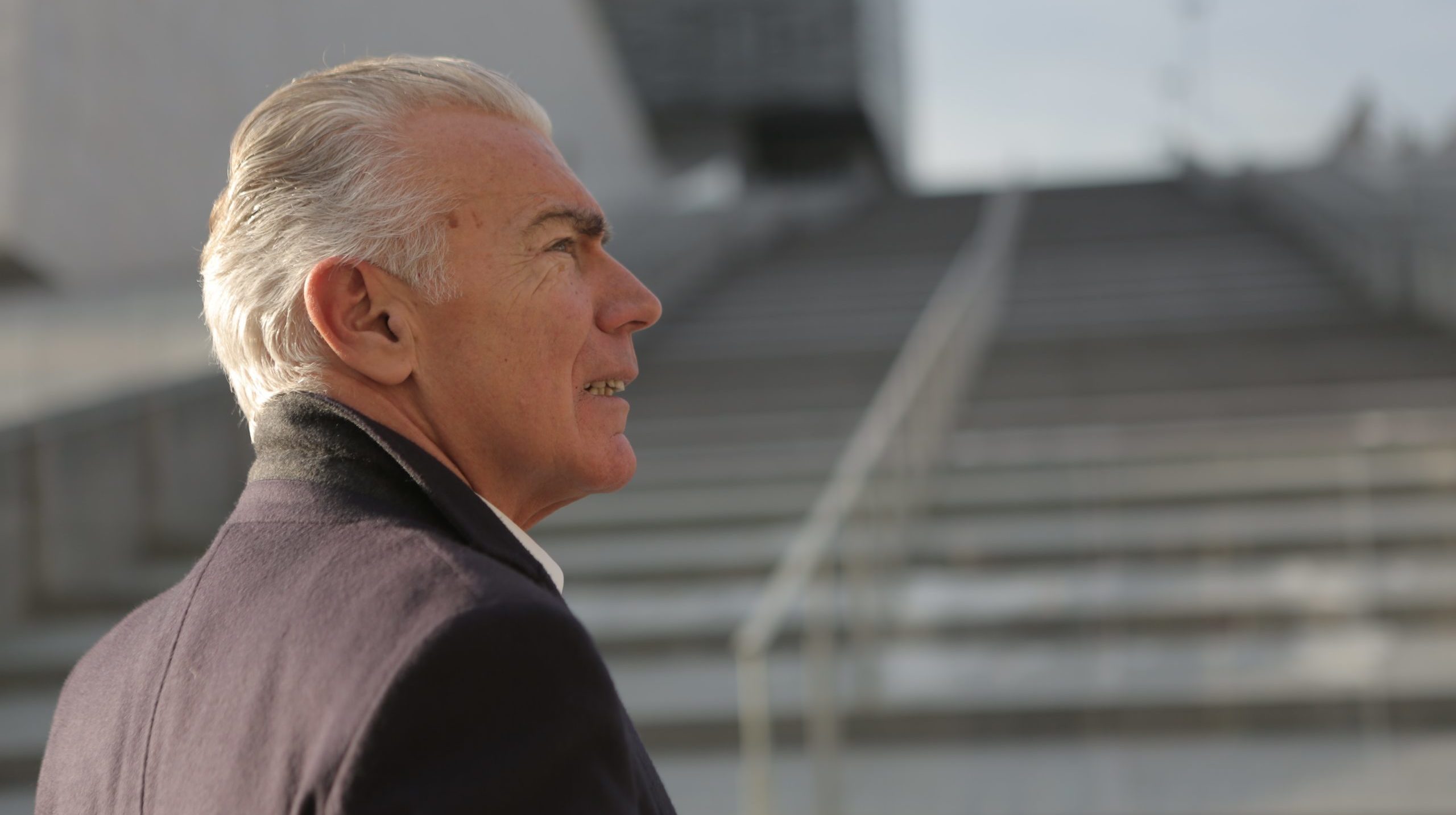 serious-elderly-gentleman-on-stone-stairs-in-city-3789115-scaled-e1596032255975